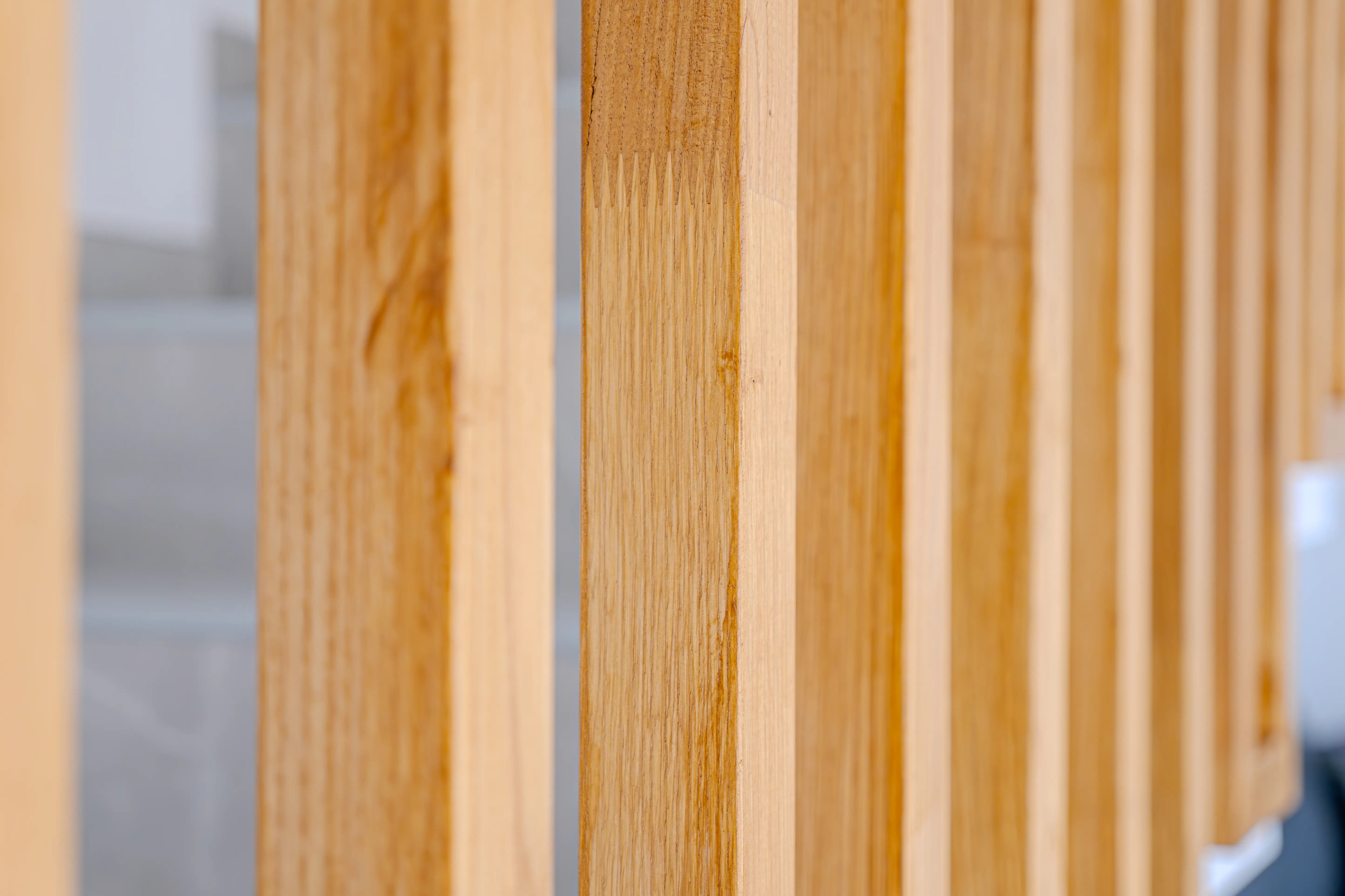 A picture of the wooden slats at the edge of the staircase.