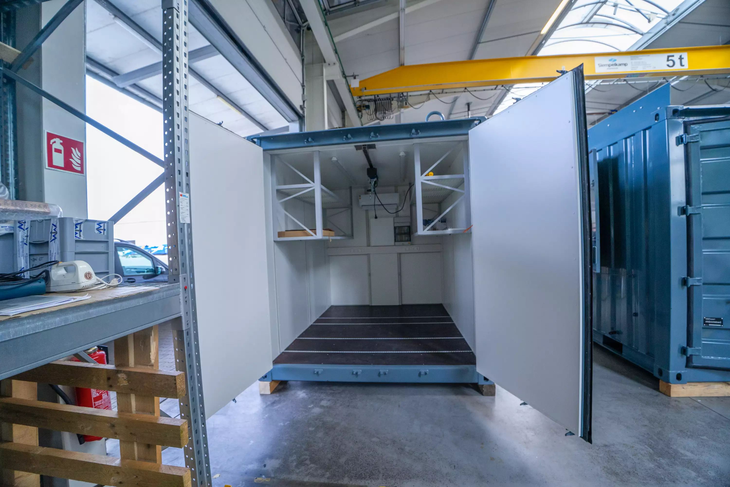 Empty container in workshop waiting to be equipped with a customized WTW antenna solution