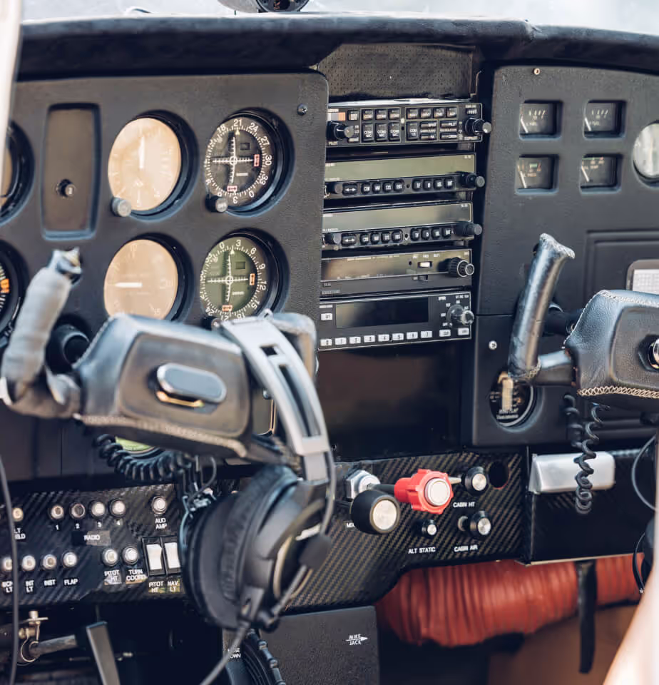 Close up of instrument panel in an aircraft that shows the controls that enable the pilot to fly the aircraft.