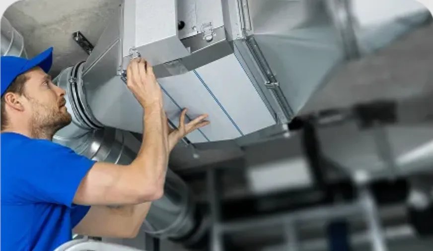 HVAC technician servicing Denver home