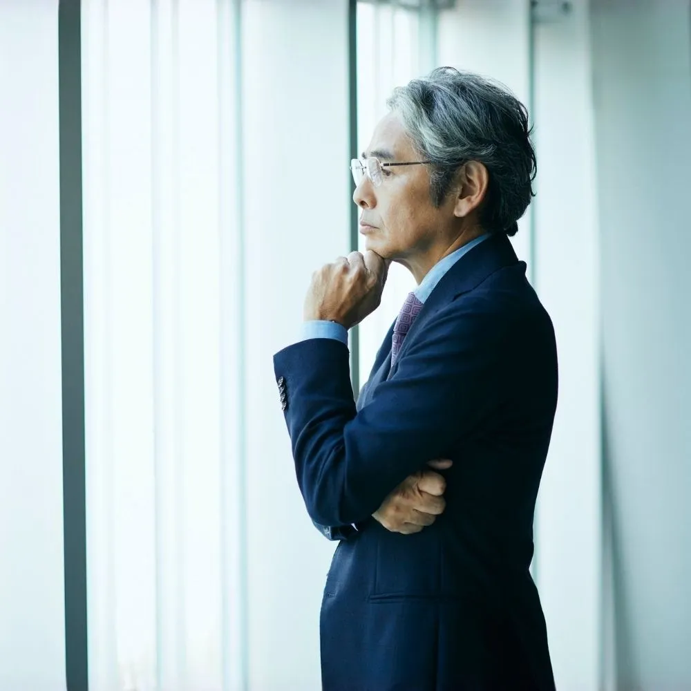 businessman looking out the window