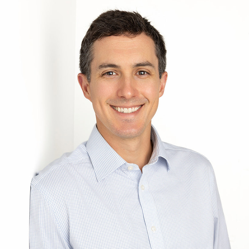 Professional headshot of Andrew Slusser