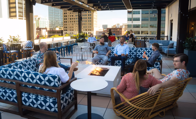 A group of people enjoying The Bradley Resort outside. 