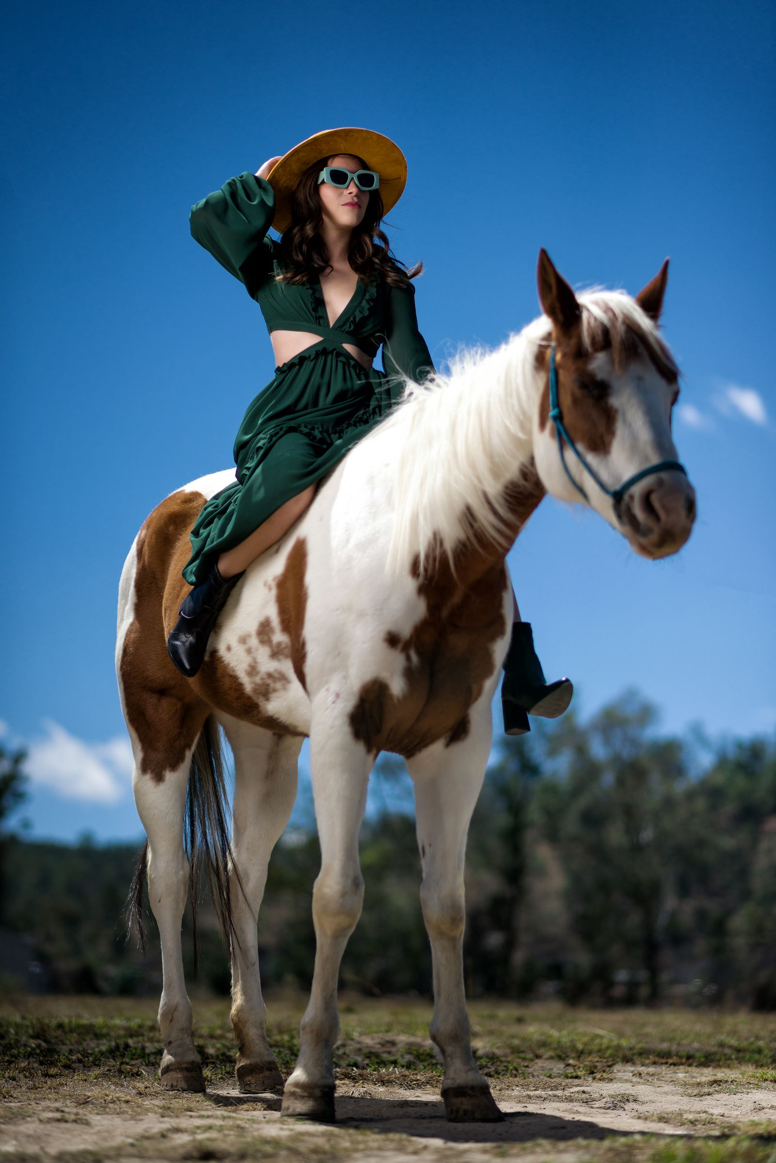 Woman in an elegant hat at a derby-style outdoor event
