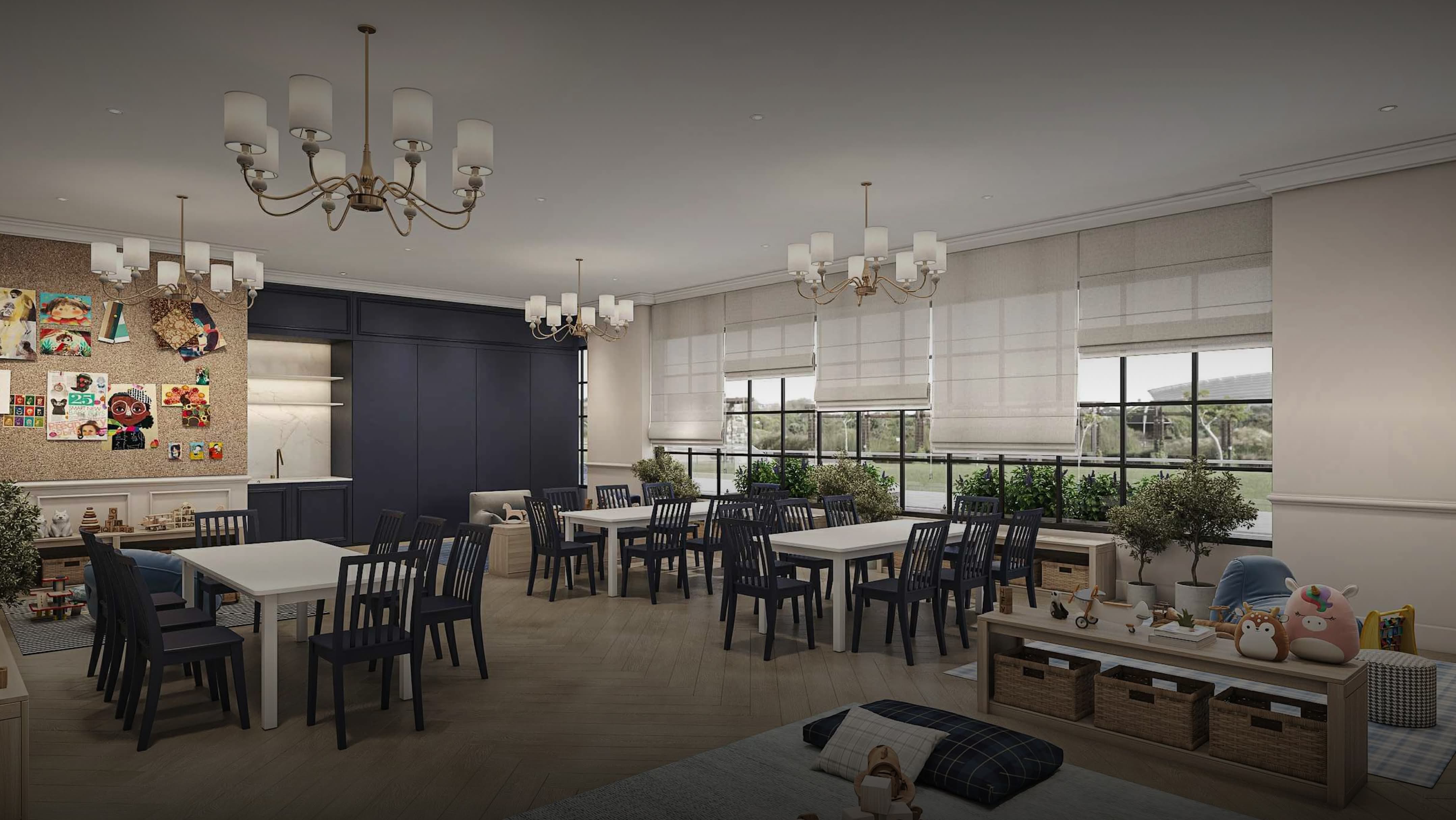 Modern classroom with white tables, black chairs, chandeliers, and large windows