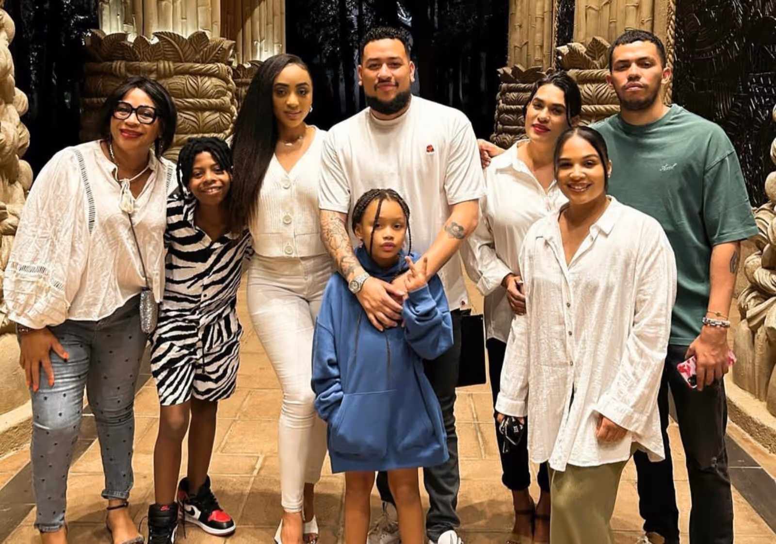 AKA posing for a photo with his family