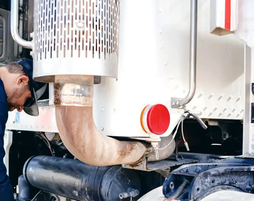 Mechanic provides truck exhaust system