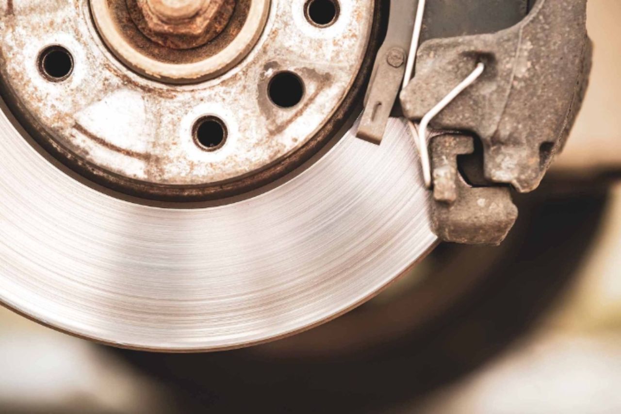 Close-up of a commercial vehicle brake rotor and caliper, highlighting brake system components essential for safe stopping performance.