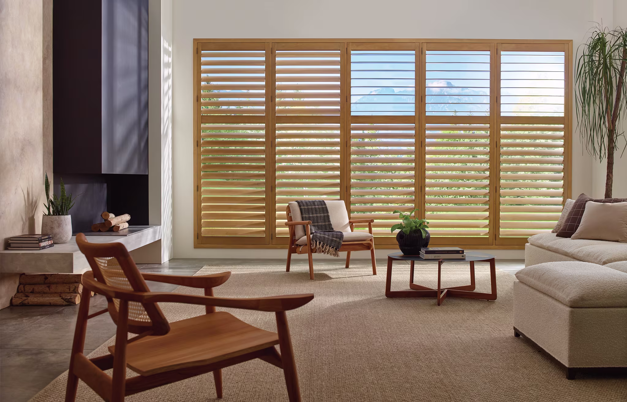 Premium custom interior shutters in wood and vinyl materials for elegant window treatments