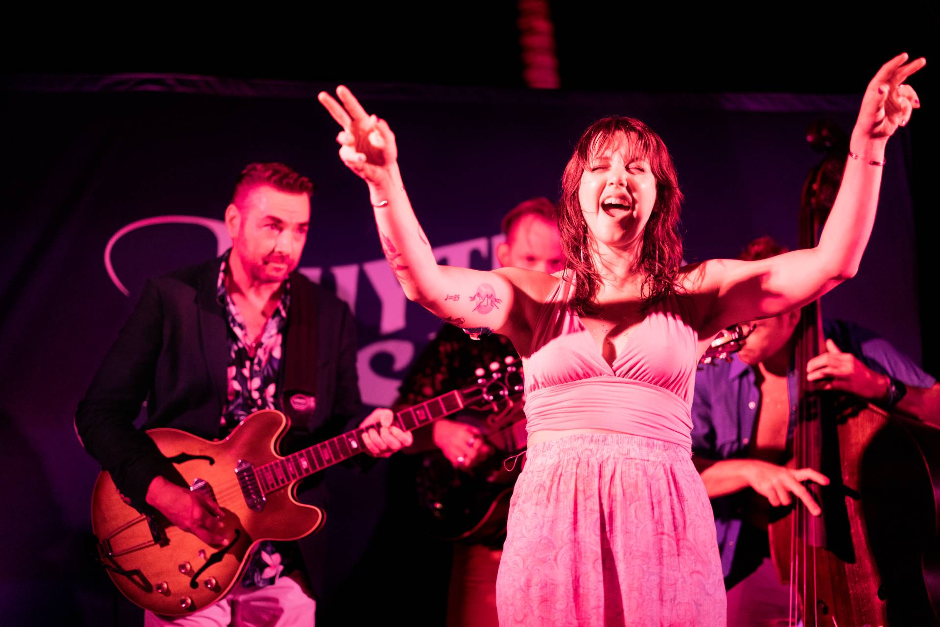 Megan Letts singing at a Rhythm & Sails show