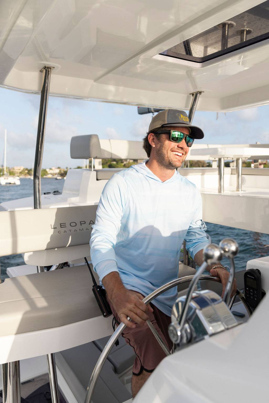 Captain at the helm of a catamaran