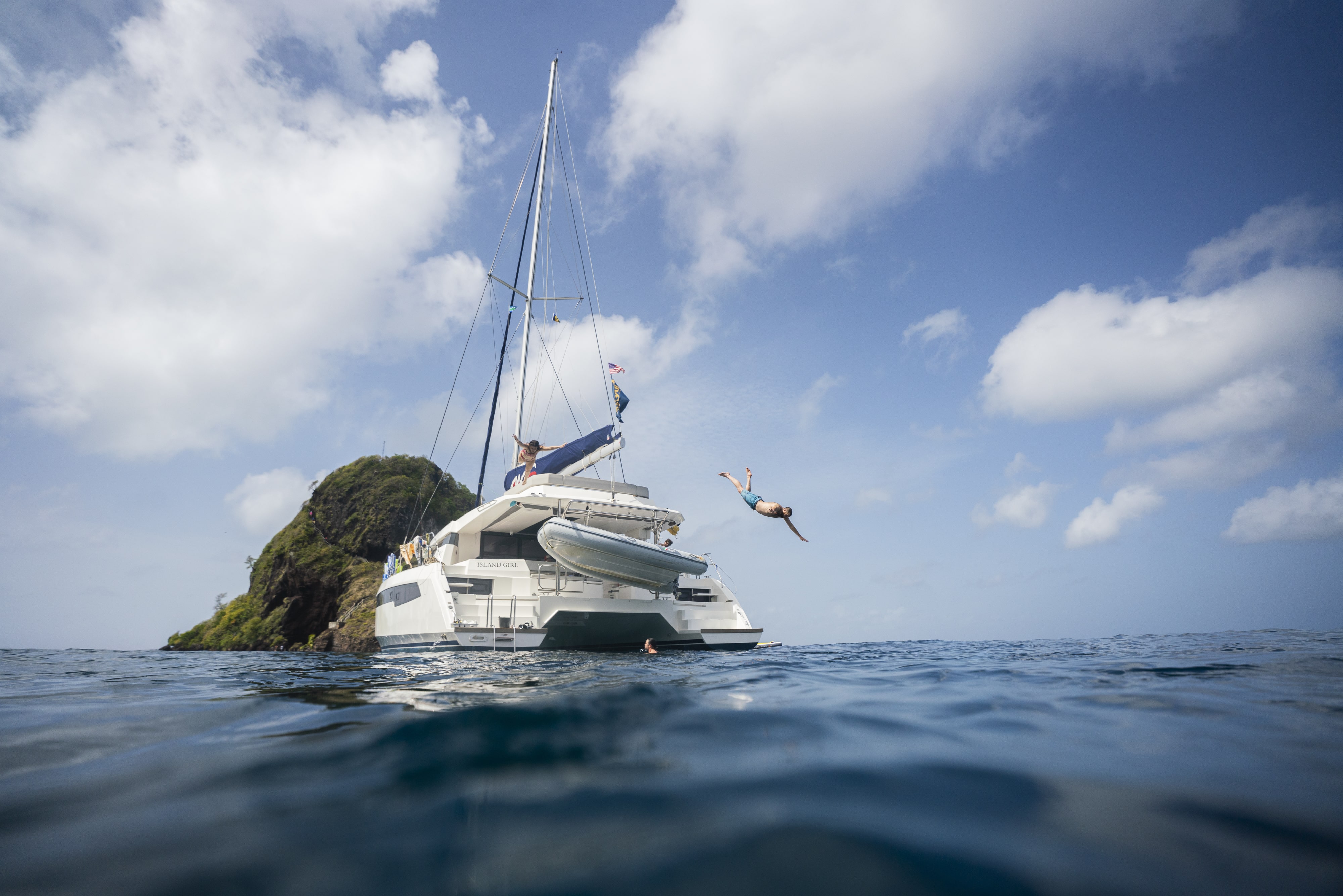 Man diving off a boat in St. Vincent