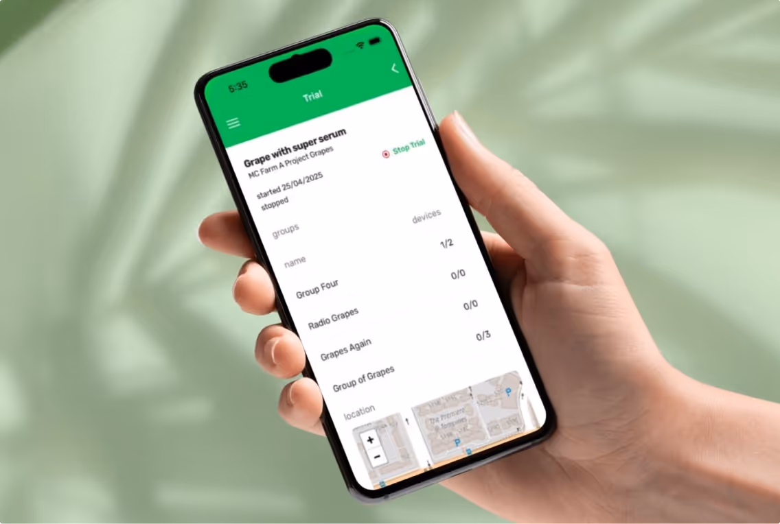 Hand holding phone with bio signals app showing