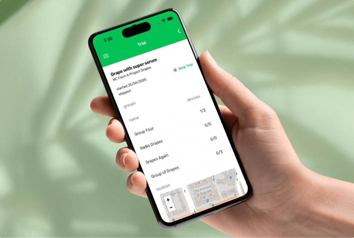 Hand holding phone with bio signals app showing