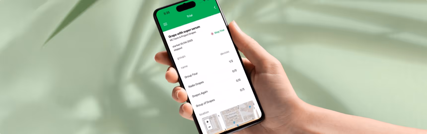 Hand holding phone with bio signals app showing