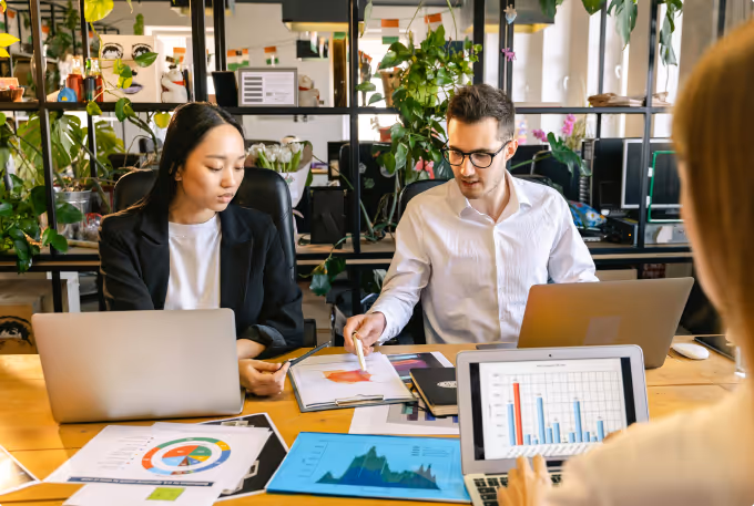 People in office looking at graphs