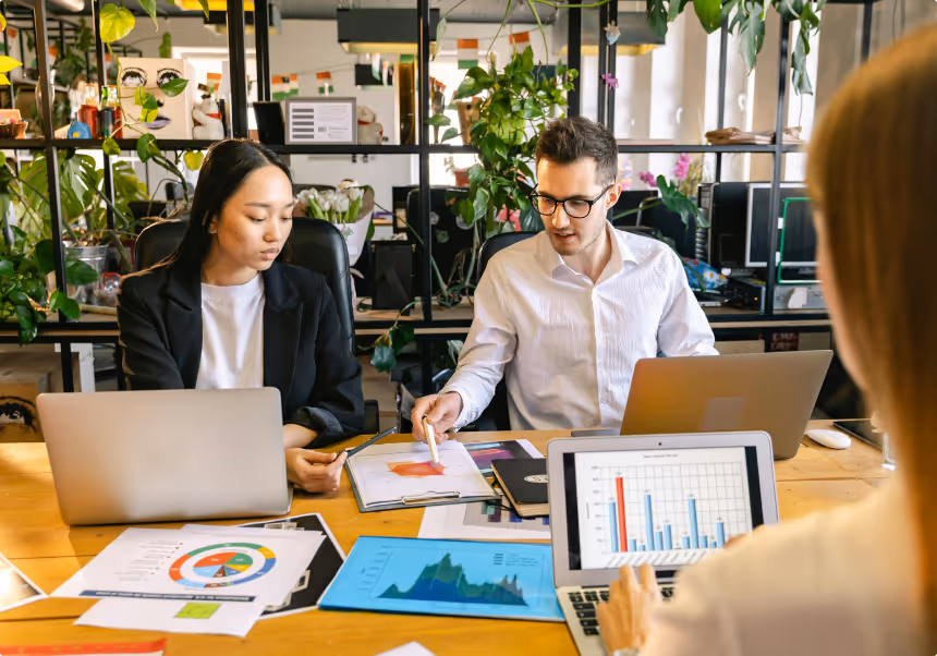 People in office looking at graphs