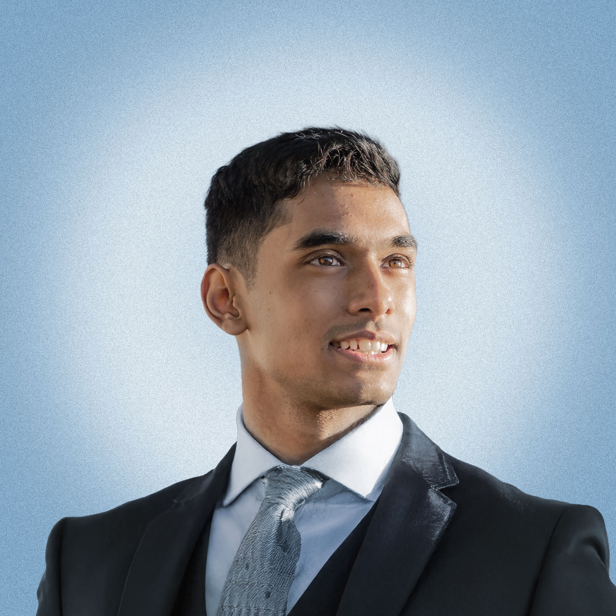 A headshot photograph of Joshua Chandar.