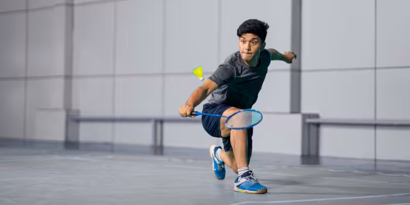 Business owner playing badminton 