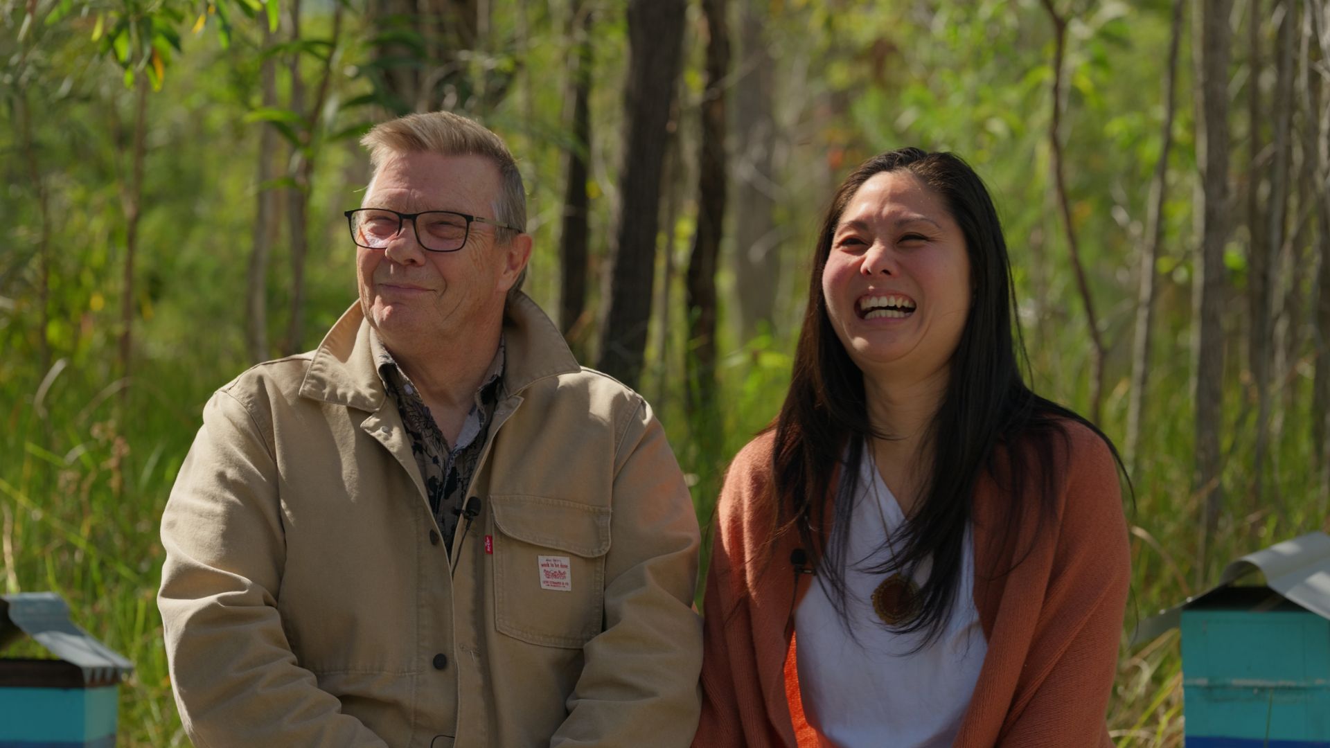 HERO: Cinematic wide shot of a regional business owner in their element - workshop, coastline, or storefront. Warm natural light, authentic moment.