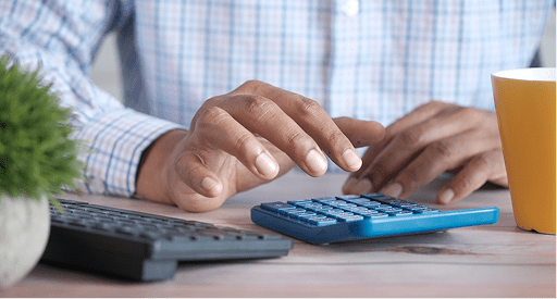 A hands showing using a calculator