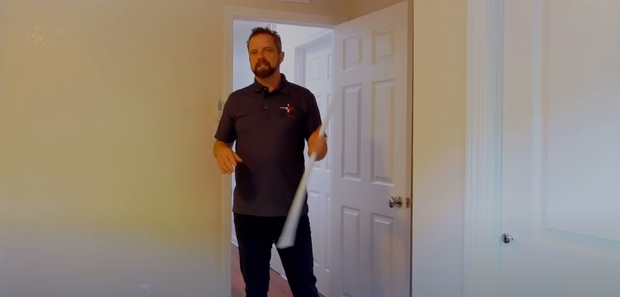 AIRWALL X placing in a door way with rod