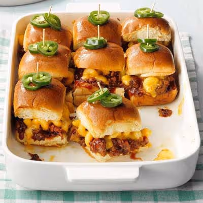 A white tray of slider hamburgers.