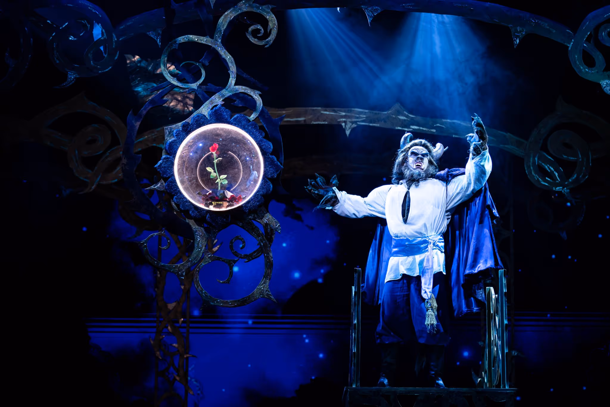 An actor in full makeup portrays the character of The Beast from Beauty and the Beast.