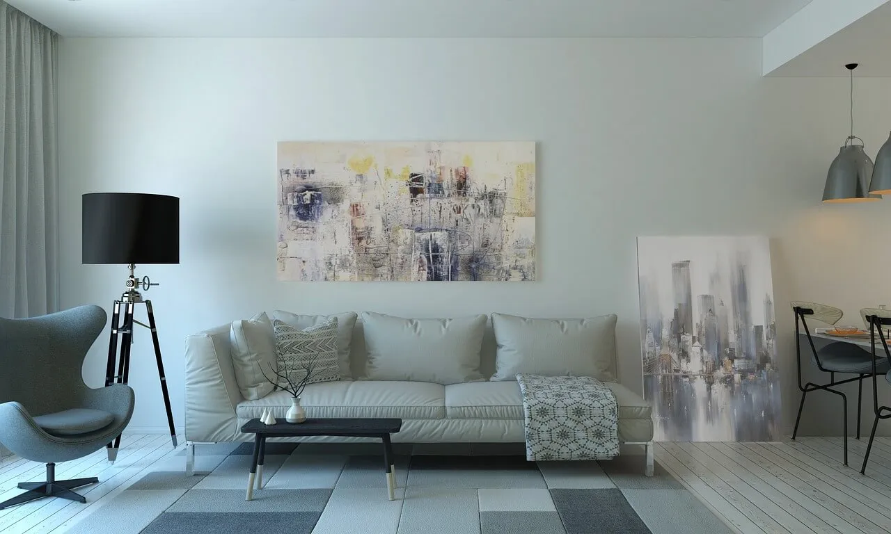 A living room with light walls and cosy sofa
