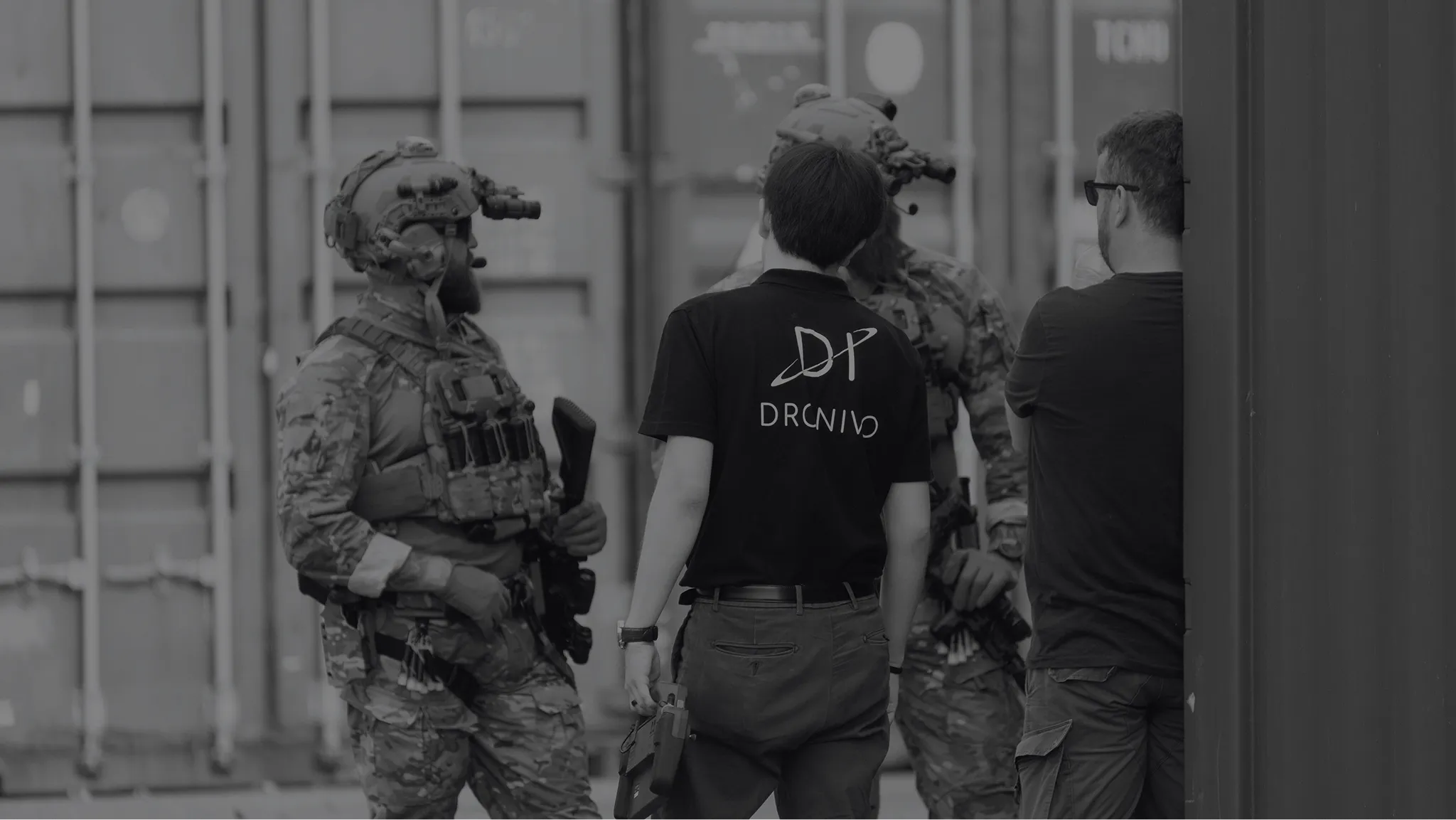 A group of men walking down a street next to each other.