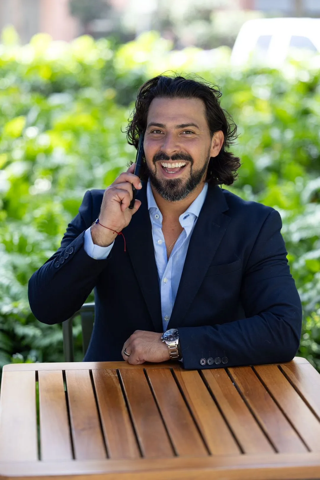 Rudy on the phone with a client