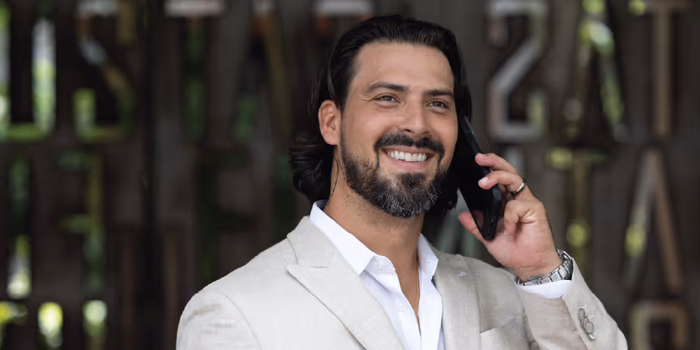 Rudy communicating with a client over the phone