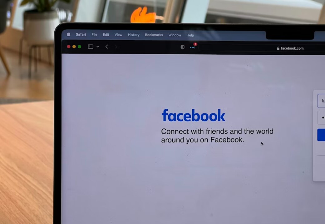 Facebook login page displaying the platform's tagline to connect with friends and the world.