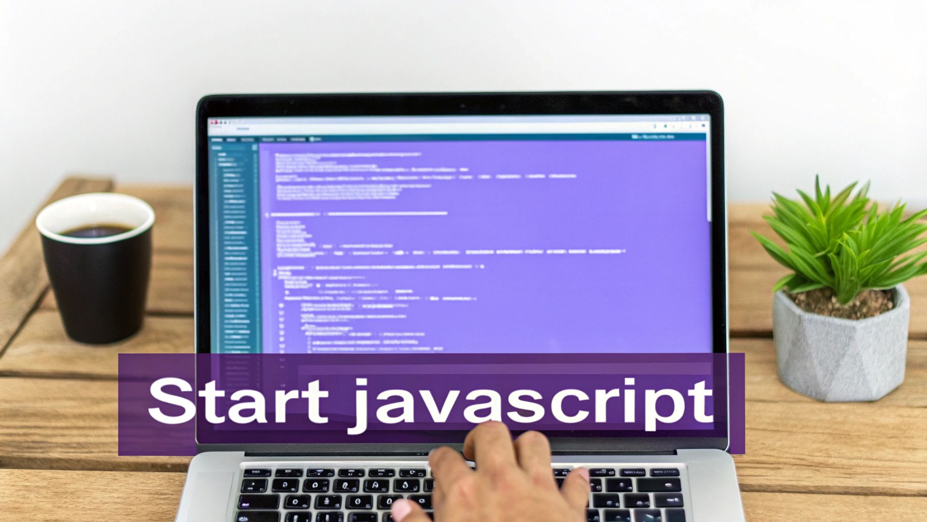 A person's hands typing JavaScript code on a laptop keyboard.