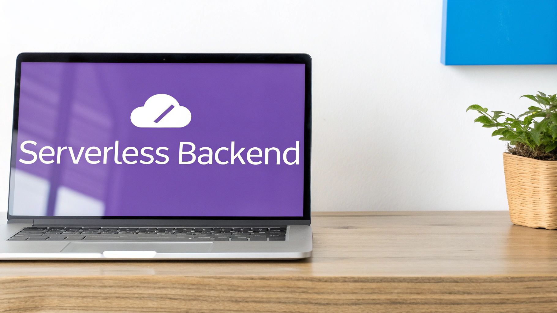 A laptop on a wooden desk displays a purple screen with a serverless backend cloud icon and text.