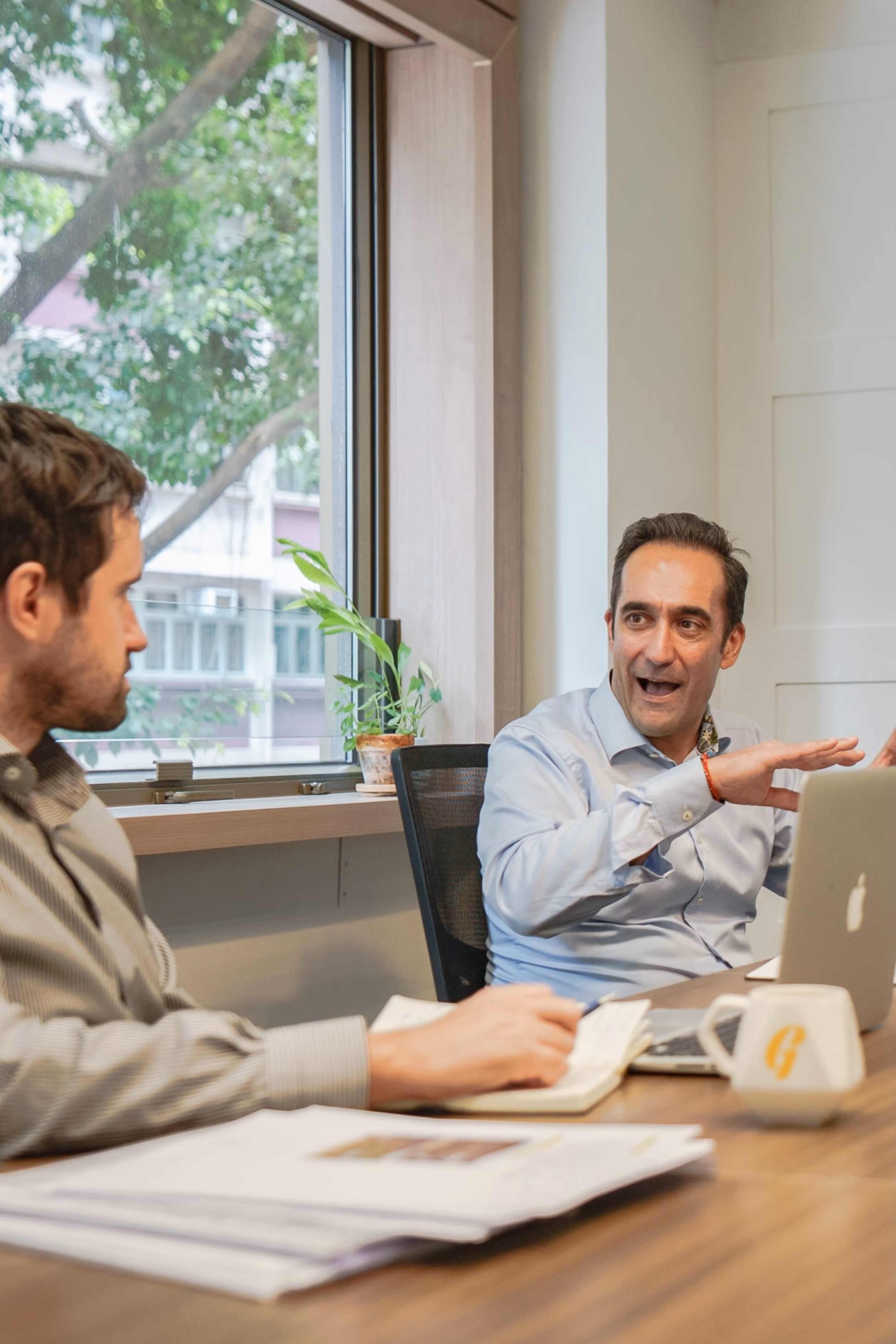 coworkers talk business in a meeting room