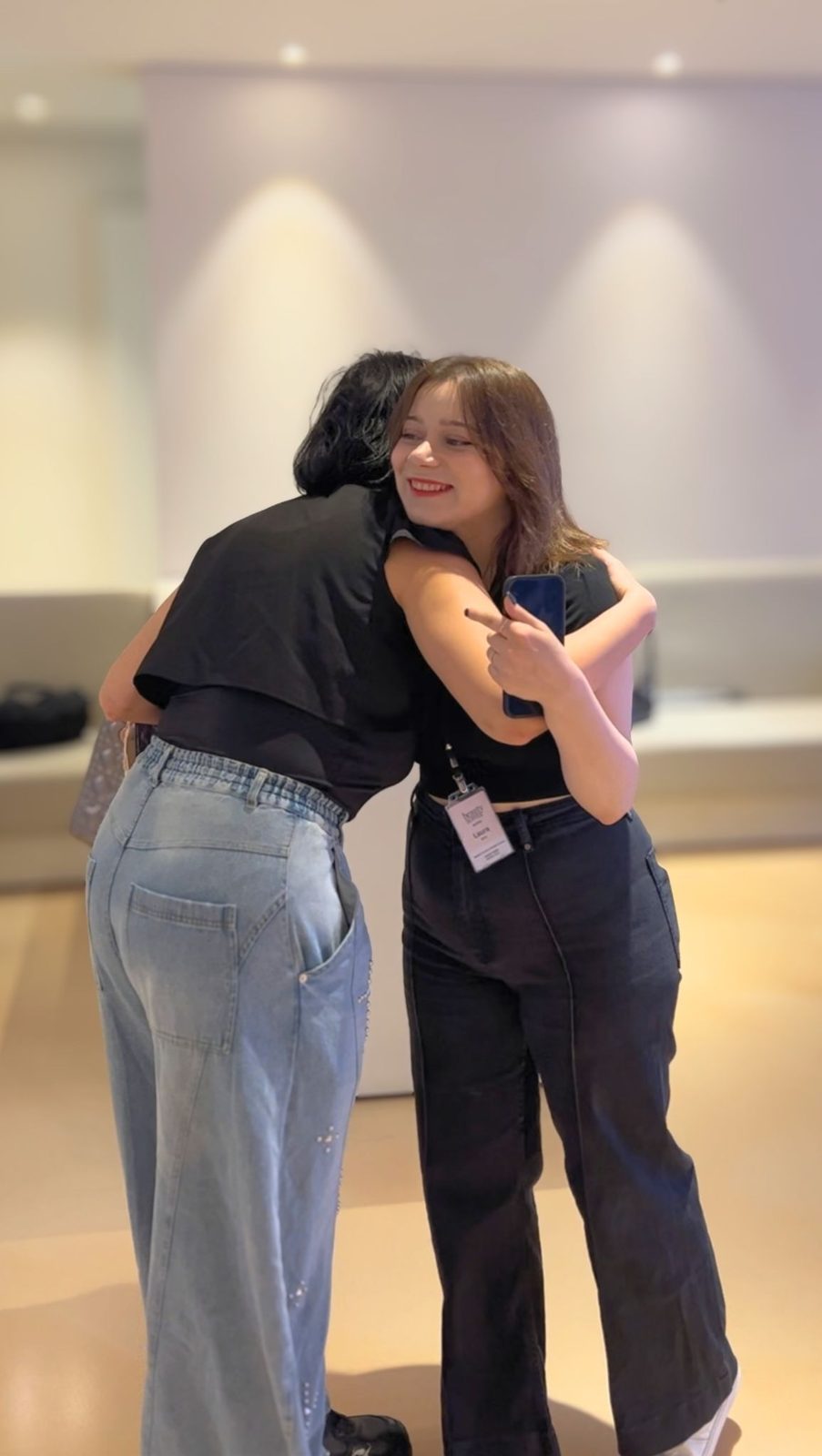 Beauty Hopper coordinator greeting a patient with a warm hug in the clinic lobby