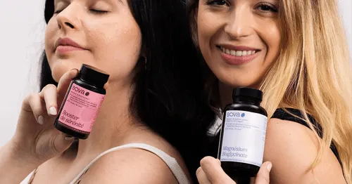 two smiling women presenting a Sova product