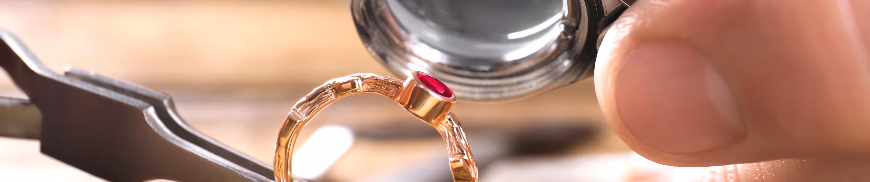 Gold ring under a magnifying glass