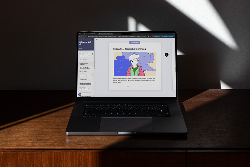 Laptop showing the Deutsche Depressionshilfe website with an illustration about depression symptoms, featuring abstract clouds around a person.