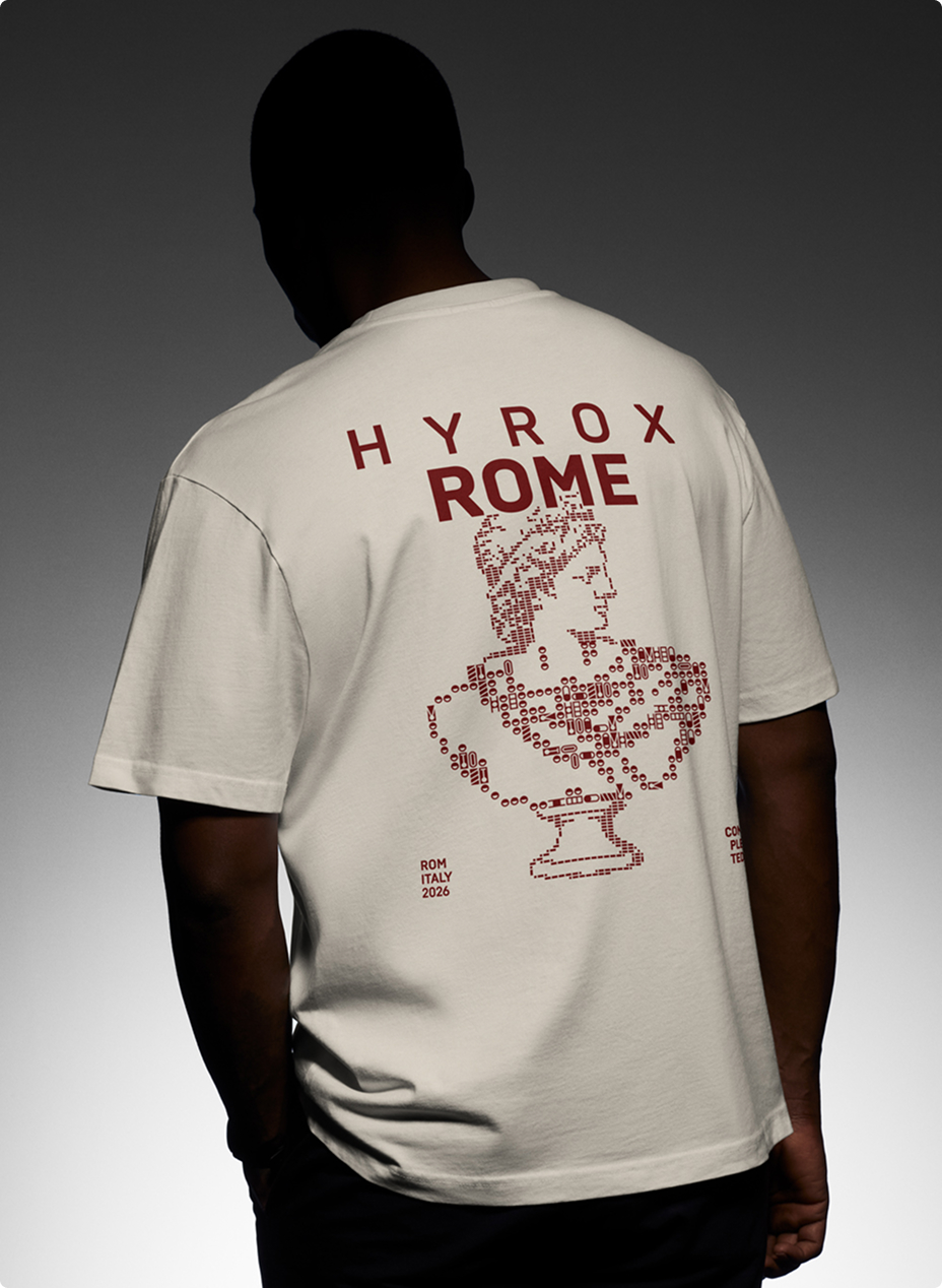 Person seen from the back wearing a yellow t-shirt with red text and design, featuring 'HYROX ROME' and an artistic bust made of HYROX icons, along with the words 'ROM ITALY 2026'.