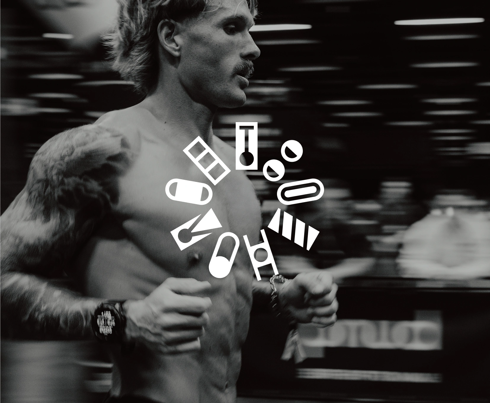 Black and white photo of a shirtless man with a mustache and tattoos running, with a smart watch on his wrist and stylized white HYROX icons arranged in a circular pattern over his chest.