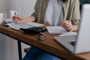 A person gathering documents for a grant proposal