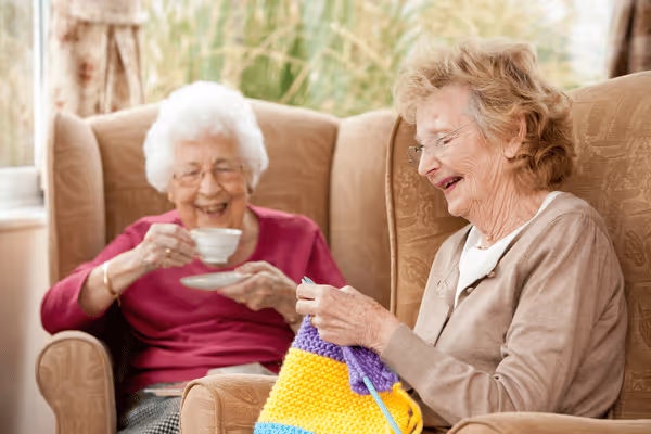 Two older woman laughing and spending time together