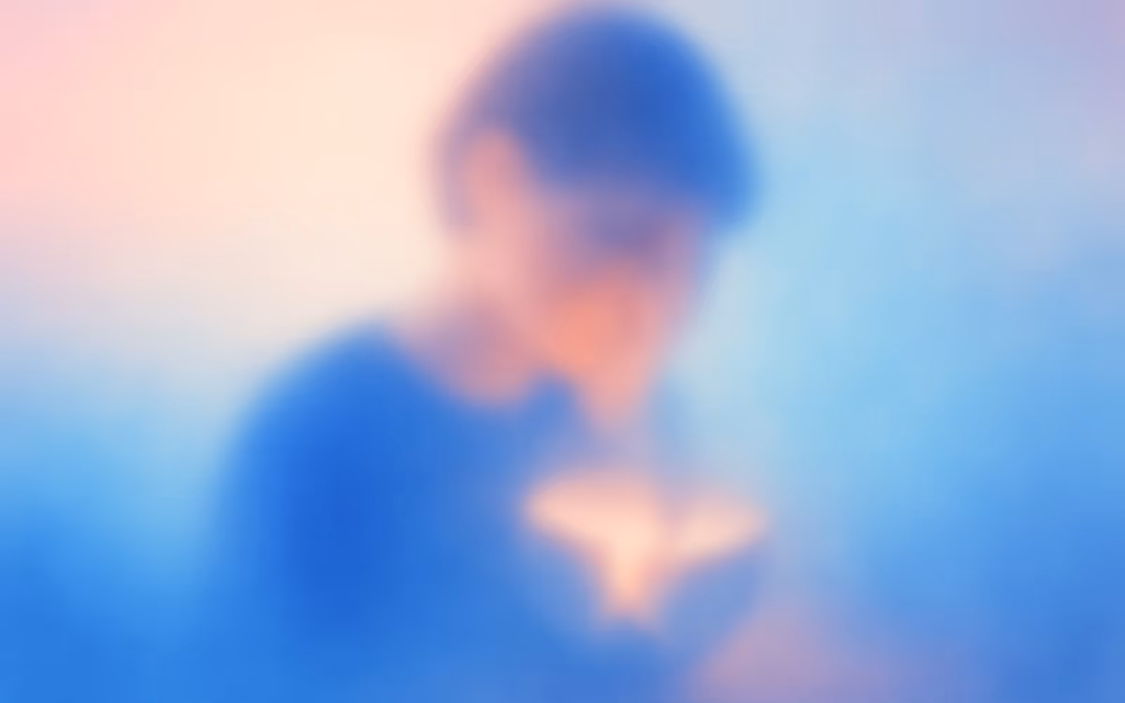 Soft gradient portrait of a creative thinker, edges dissolving into blur to express shrinking confidence.