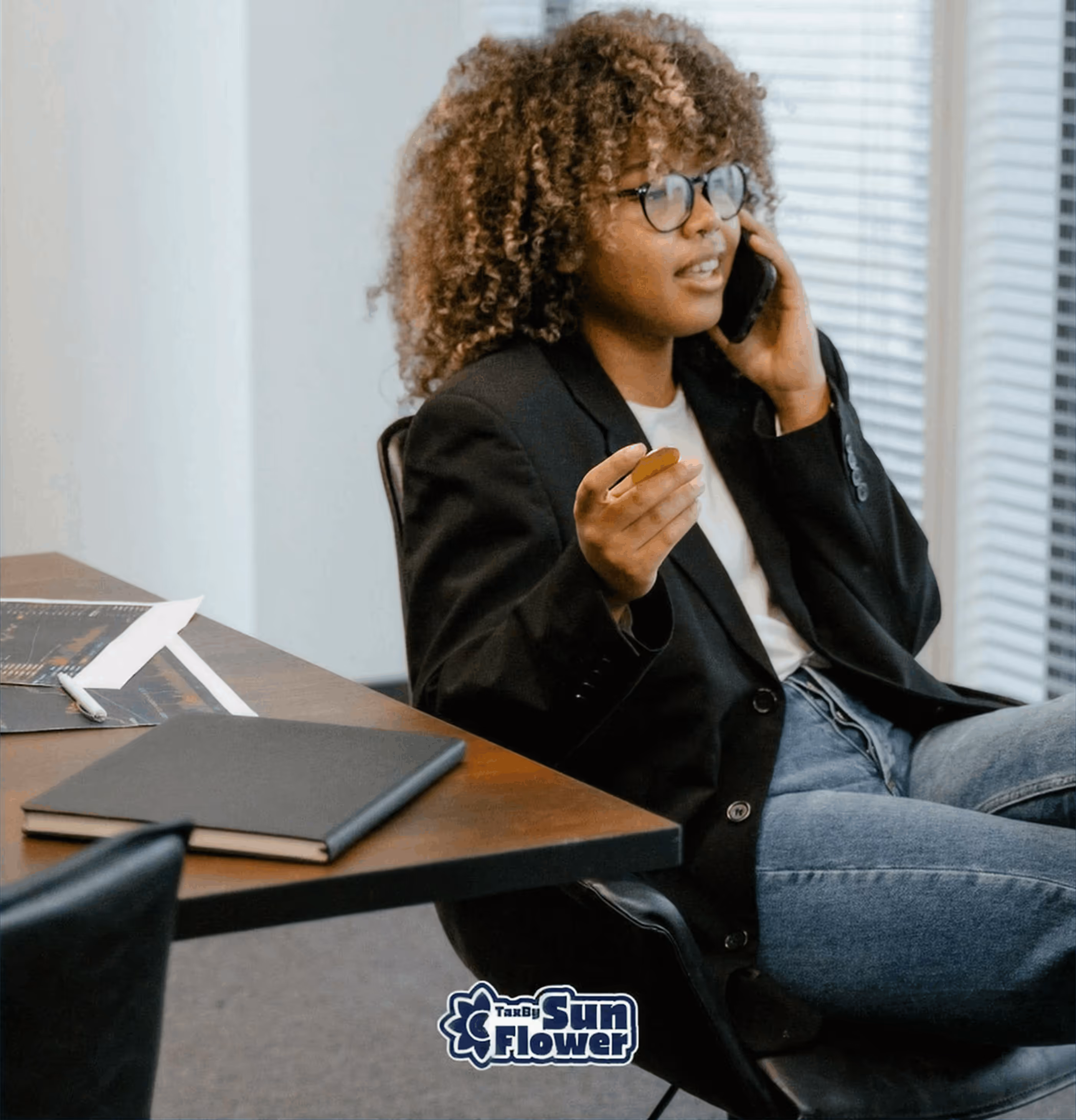 Tax by Sunflower Employee on the phone in office.