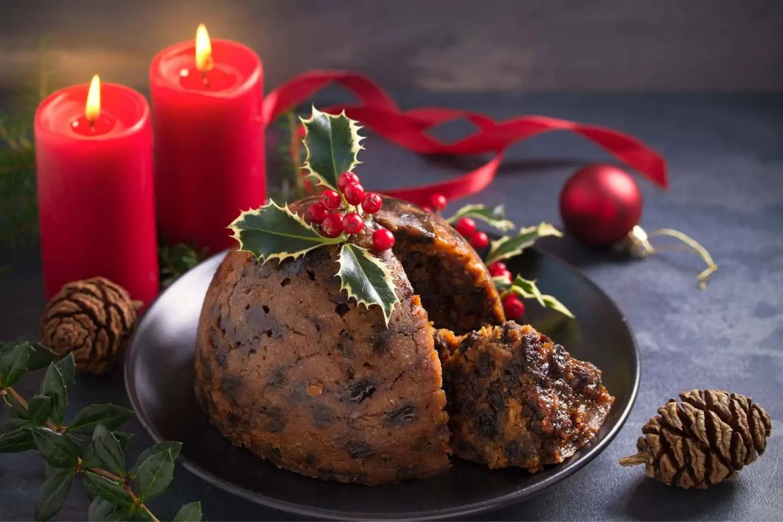 A festive Christmas pudding topped with vibrant red berries