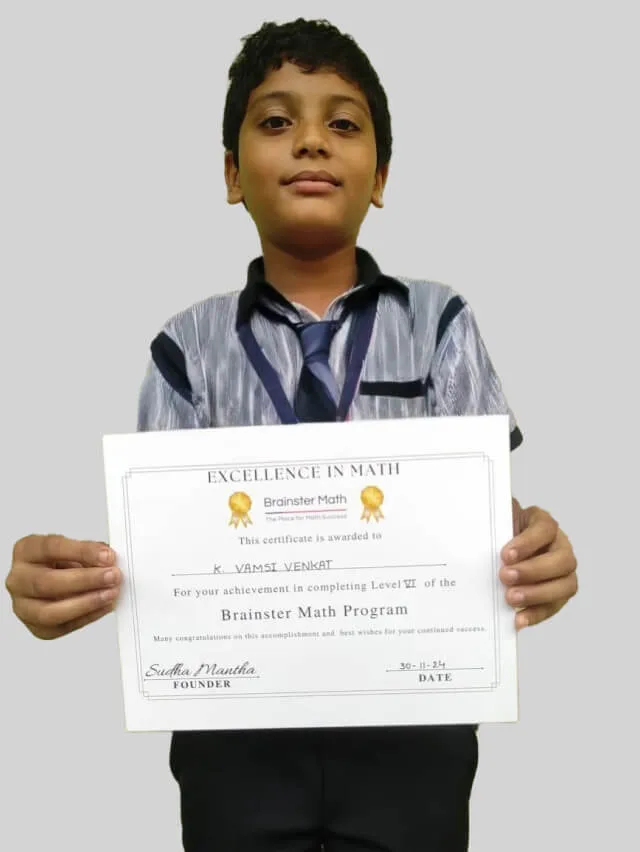 Student proudly holding up a Brainster Math certificate.