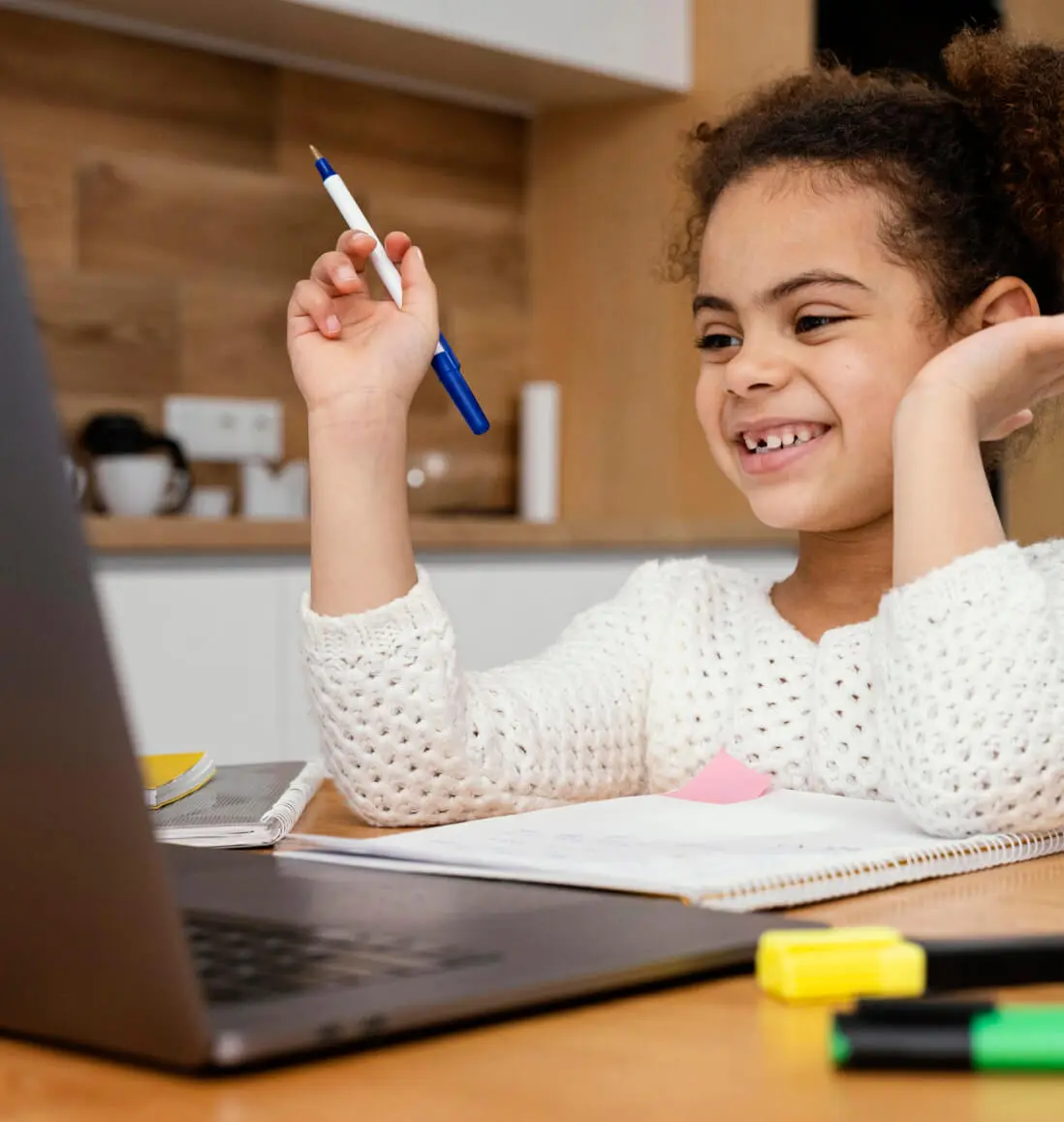 Young girl happily learning with Brainster's kids math tutoring program.
