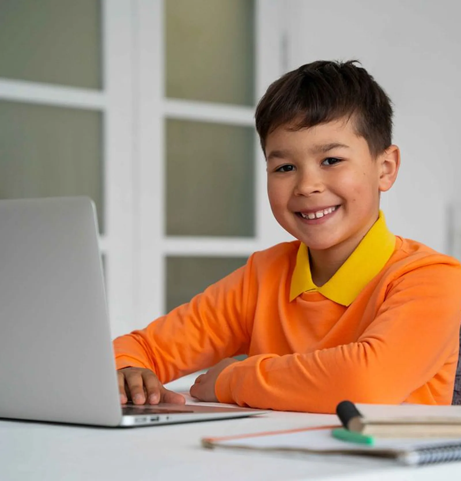 Young girl happily learning with Brainster's kids math tutoring program.